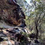 Sidling along below the cliffline.